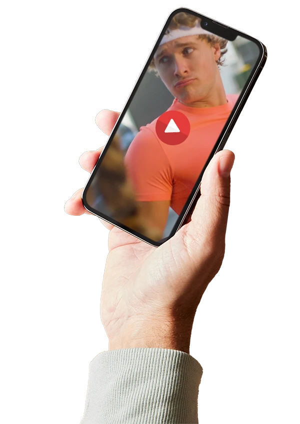 Hand holding a phone playing a Brisbane video campaign by Umbrella Creative